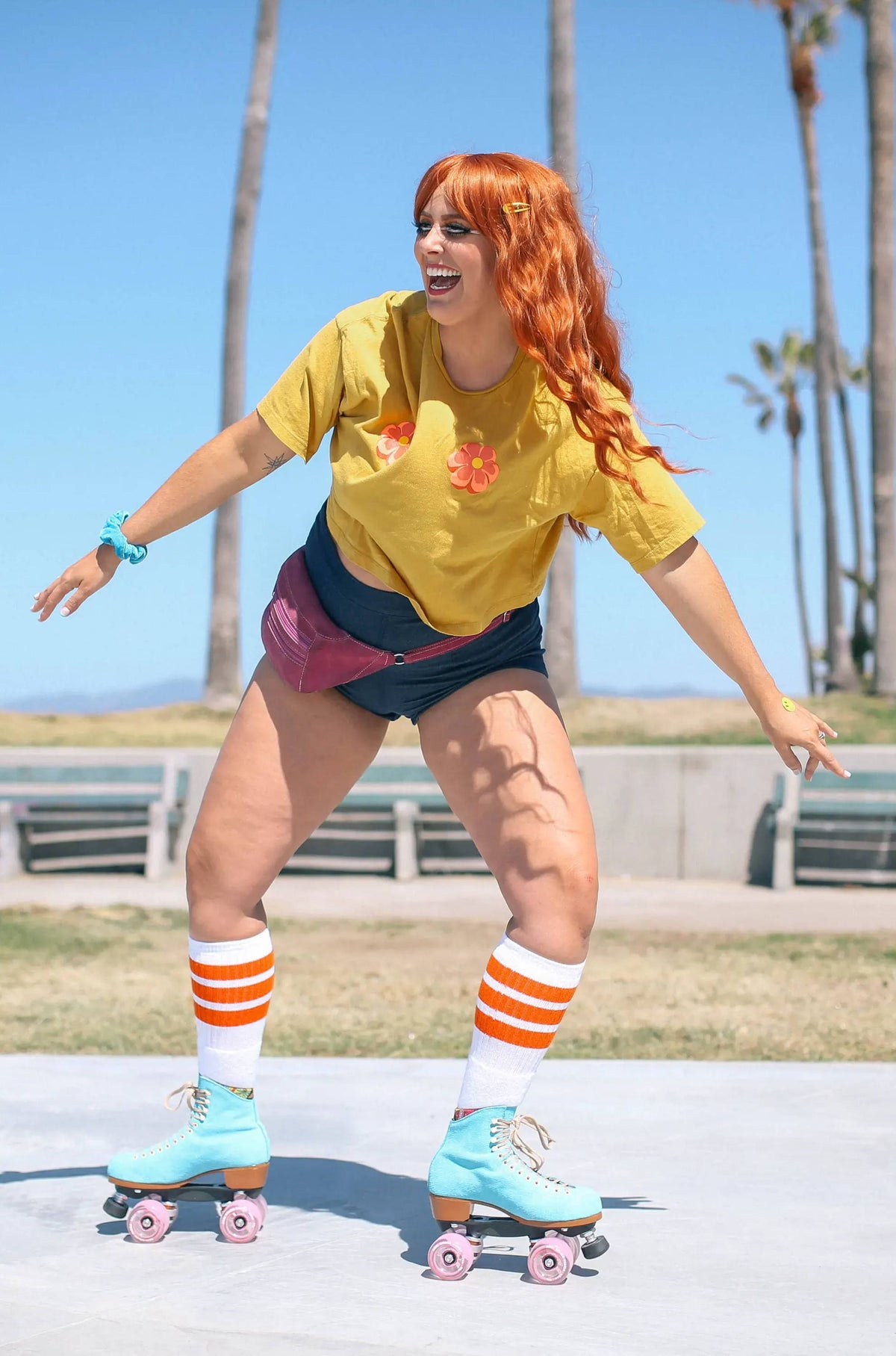 True Blue Moxi Lolly Malibu Barbie roller skates worn outdoors on a beachfront path